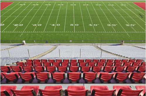 Empty Football Field and StadiumSeats